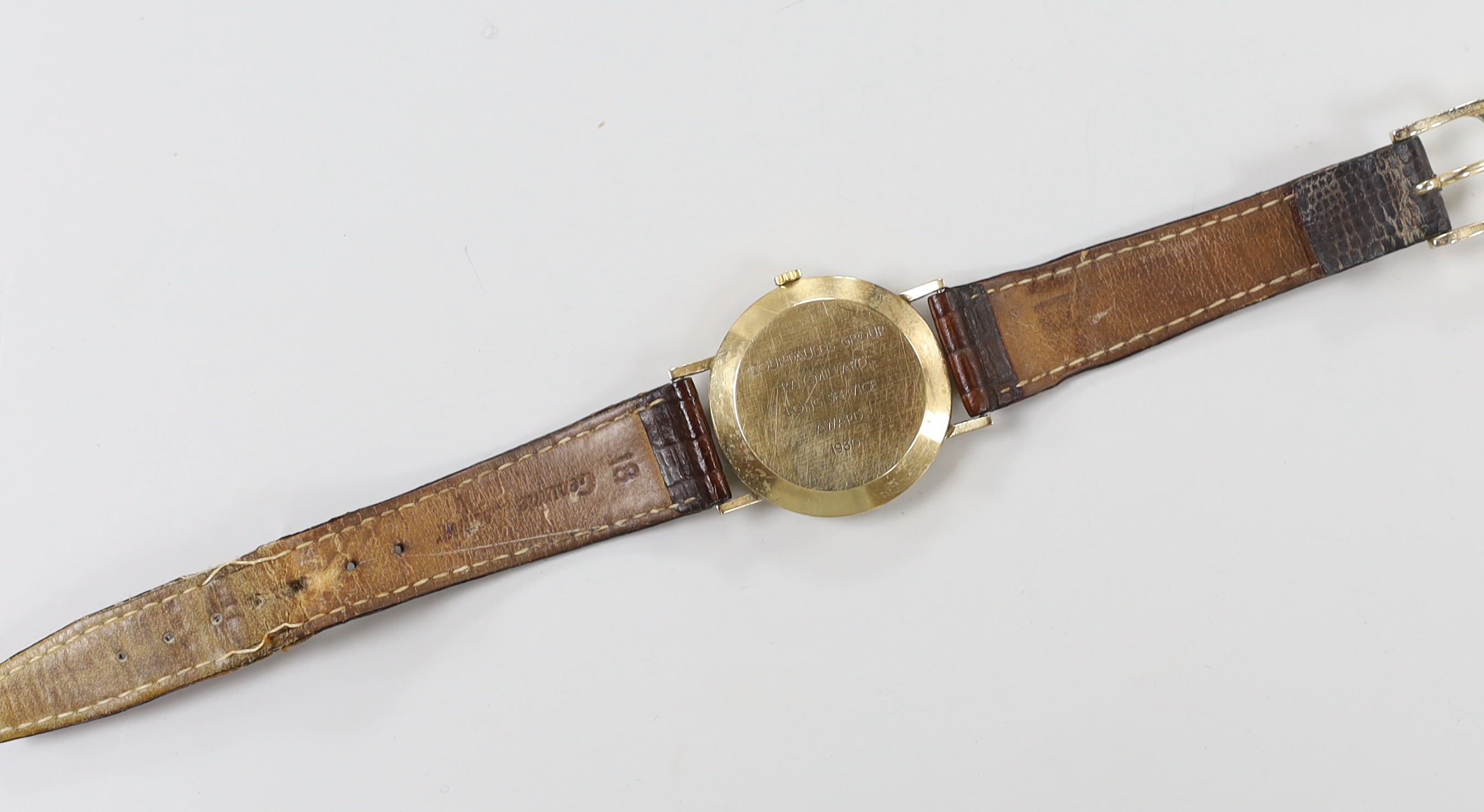 A gentleman's yellow metal Perry Greaves manual wind wrist watch, with case back inscription.